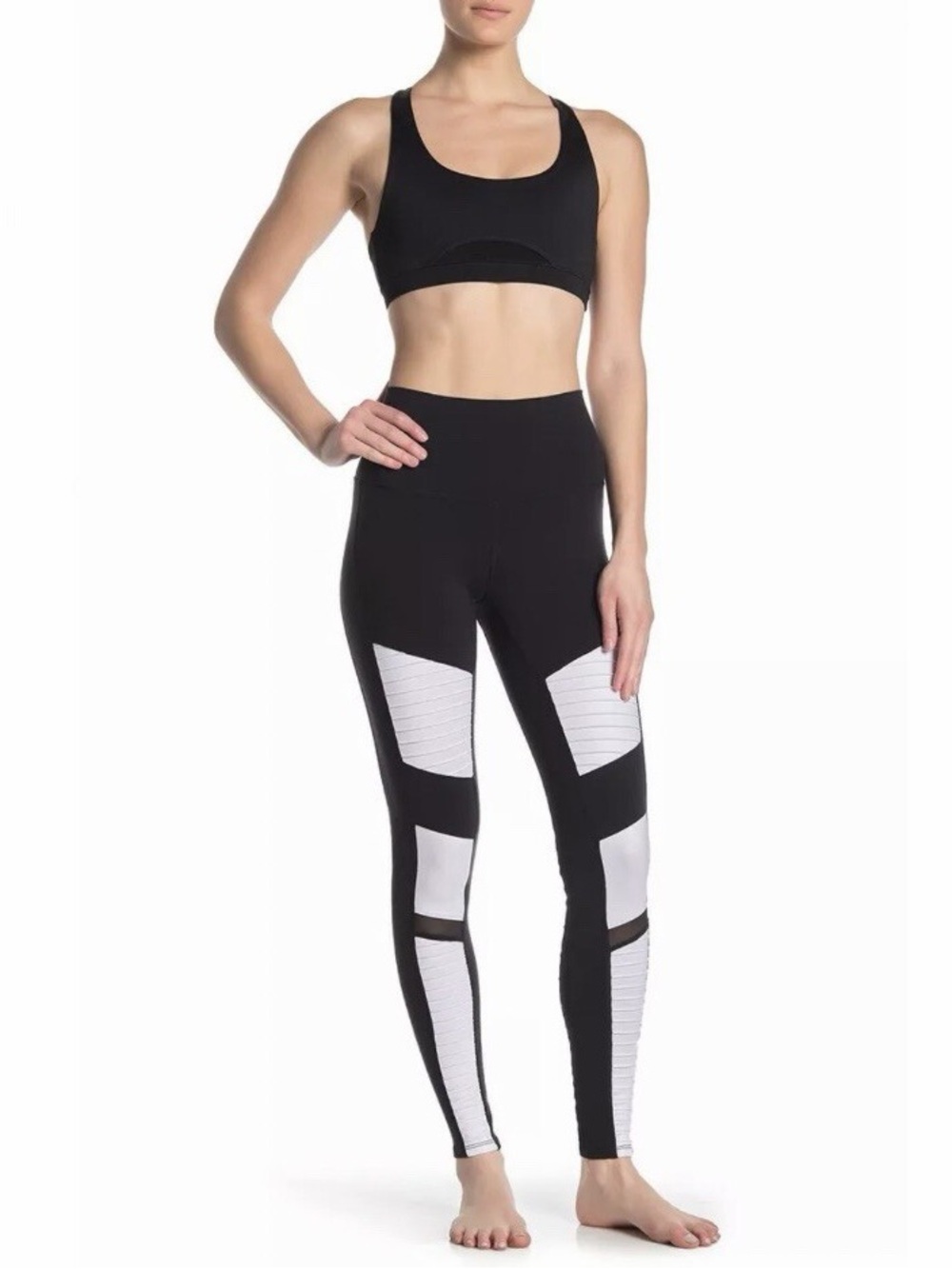ALO Yoga Moto Leggings in a black and white